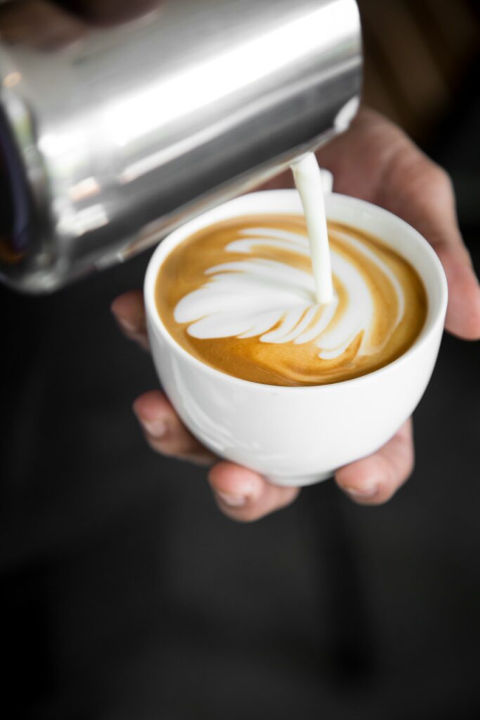 barista pouring coffee