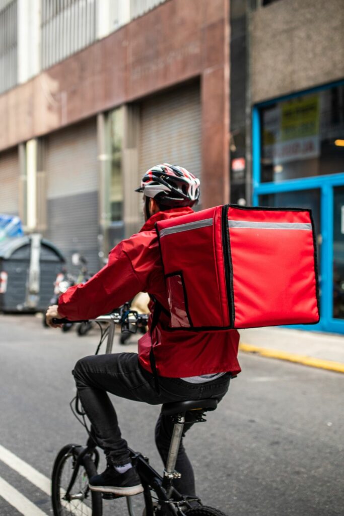 doordash challenges - man on bike doing food deliveries