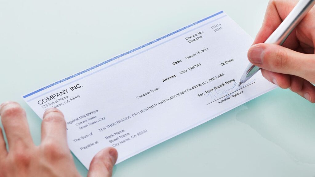 How does a bank verify a personal check?