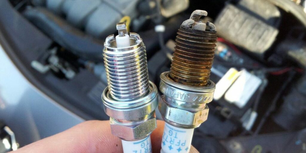 What should I do after changing spark plugs?